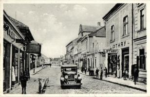 Rimaszombat, Rimavska Sobota; utcakép, Lipthay L. és Cséman üzlete / street view with shops, automobile, "1938 Rimaszombat visszatért" So. Stpl (kis szakadás / small tear)