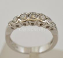 Ezüst(Ag) 7 apró szintetikus kővel díszített gyűrű, jelzett, méret: 48, bruttó: 2,7 g