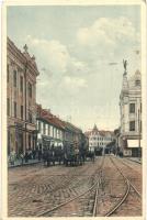 Temesvár, Timisoara; Fabrikstadt, Hauptgasse / Gyárváros, Fő utca, Goldman üzlete, Marokkaner szálloda, villamos / main street, shops, hotel, tram (EK)
