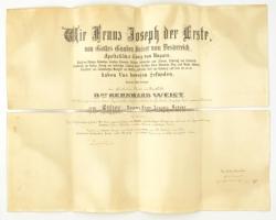 1896 A Ferenc József-rend lovagkeresztjének adományozó oklevele, Dr. Weisz Bernát bártfai közjegyző részére, Ferenc József és a rend kancellárjának saját kezű aláírásával, rányomott szárazpecséttel, Weisz Bernátot a kitüntetéssel ábrázoló műtermi fotóval, hajtásnál elvált, 54x72 cm / Awarding document of the Order of Franz Joseph Knights Cross for dr. Bernhard Weisz, with embossed stamp and autograph signature of Franz Joseph and the Orders Cancellor, folded, torn in two, 54x72 cm