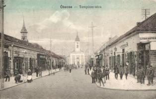 Óbecse, Stari Becej; Templom utca üzletekkel, Lévai Lajos kiadása / street view with church and shops (EK)