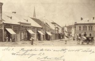 1899 Hátszeg, Hateg; utcakép, Schuleri T., Groszeck Károly és R. és B. Popovits üzlete, lovas hintó, templomok / street view with shops, chariot, churches, photo