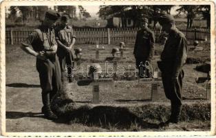 Magyar katonák második világháborús katonai temetőben / WWII Hungarian soldiers in a military cemetery with graves of soldiers, photo (EK)