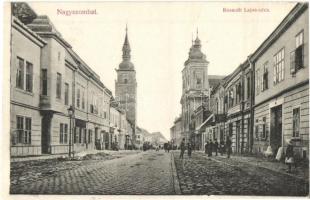 Nagyszombat, Trnava; Kossuth Lajos utca, templomok, üzletek / street view with churches and shops