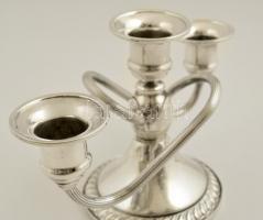Dekoratív ezüst (Ag.)  háromágú gyertyatartó, súlyozott, jelzett, horpadásokkal, m:12,5 cm, bruttó:3...