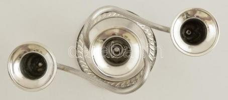 Dekoratív ezüst (Ag.)  háromágú gyertyatartó, súlyozott, jelzett, horpadásokkal, m:12,5 cm, bruttó:3...