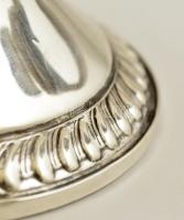 Dekoratív ezüst (Ag.)  háromágú gyertyatartó, súlyozott, jelzett, horpadásokkal, m:12,5 cm, bruttó:3...