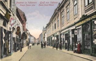 Vukovár, Franje Josipa ulica / Franz Josef Gasse / street view with the shops of Leopold H. Freund and Gjorgj. Verlag L.H. Freund  (EK)