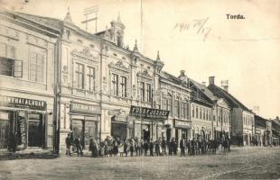 Torda, Turda; utcakép, Bonyhai Aladár, Hartman Ignácz, Pál Lajos és Amberg J. Miklós üzlete, Füssy József Könyvnyomdája és saját kiadása / street view with shops (fa)