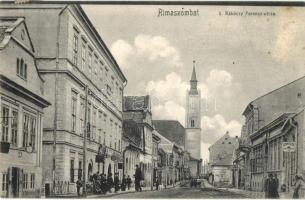 Rimaszombat, Rimavska Sobota; II. Rákóczi Ferenc utca, Schnitzer üzlete, templom / street view with shops and church
