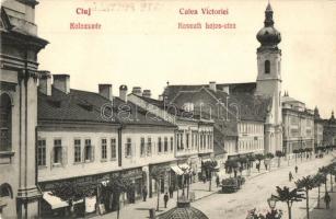 Kolozsvár, Cluj; Kossuth Lajos utca, templom, Andrásovszky Lajos, Fodor Antal, Juhos József és Kun Mátyás üzlete / Calea Victoriei / street view with shops, church