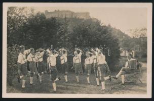 cca 1920-1940 Osztrák cserkészek, tiroli nadrágban, fotólap, a hátoldalon pecséttel, aláírásokkal,8x13 cm./ Austrian scouts, in Tyrolean trousers, photo, with stamp, and signature, 8x13 cm.
