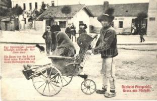 Pöstyén, Pistyan, Piestany; Egy liptómegyei paraszt feleségét tolókocsin a fürdőbe viszi, üzlet a háttérben. Gipsz H. kiadása / Ein Bauer aus der Liptau fährt seine Ehehälfte auf einem Rollwagen ins Bad / A farmer from Liptov county drives his spouse in a wheelchair to the spa, shop in the background (EK)