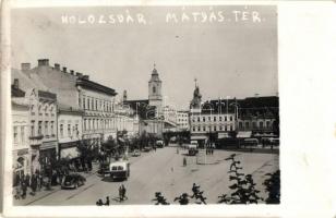 1940 Kolozsvár, Cluj; Mátyás tér, Kereskedelmi Hitelbank Rt., Petres és Pollák, Zselmerián, Fodor Testvérek, Nimberger Ernő üzletei, Albina Takarék Hitelintézet Rt., Hotel Central szálloda, automobil, autóbusz / square, banks, shops, hotel, automobile, autobus. photo (EK)