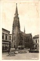 1943 Eszék, Osijek, Esseg; piaci árusok, útépítés, templom, villamos, gyógyszertár / street construction with market vendors, church, tram, pharmacy. photo