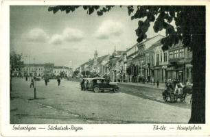 Szászrégen, Reghin; Fő tér, üzletek, automobil. Buchhandlung Philippi / main square, shops, automobiles (EK)