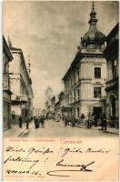 Temesvár, Timisoara; Lonovics utca, Hungária szálló, R. Illits üzlete / street view with hotel and shops