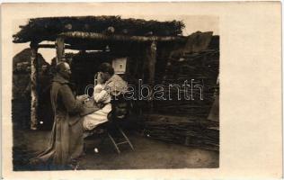 Bevetés előtti gyónás a tábori misén / WWI Austro-Hungarian K.u.K. soldier confess to the priest at the field mass before going in the battle. photo