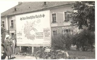 Unknown town, Das Deutsche Reich propaganda billboard, motorbicycle. photo