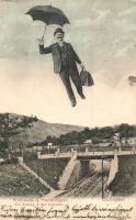 Budapest II. Hűvösvölgy, villamos sín a felüljáró híddal. Repülő úriember esernyővel, montázslap / Flying gentleman with umbrella montage postard