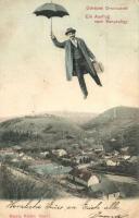 Oravicabánya, Oravita; Ein Ausflug nach Bányavölgy / látkép, esernyővel repülő úriember montázs. Kiadja Káden József / mine valley, colony, flying gentleman montage (EK)