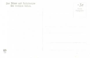 Der Führer und Reichskanzler des deutschen Volkes / Adolf Hitler in automobile with swastika armband