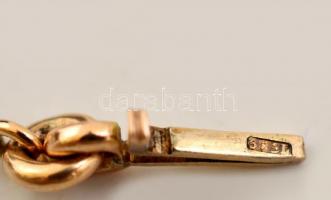 Ezüst(Ag) és arany(Au) 14K részekből álló női karkötő, apró kövekkel díszítve, jelzett, bruttó: 6,7 ...