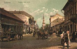 Losonc, Lucenec; Kossuth Lajos utca, lovaskocsik, dohánytőzsde, Lugos István, Schiffer Ármin és Reinfeld Antal üzlete. Bicskei Zoltán kiadása / street view with shops and horse carts