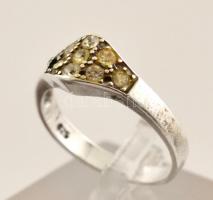 Ezüst(Ag) apró kövekkel kirakott gyűrű, jelzett, méret: 58, bruttó: 3 g