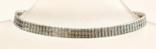 Ezüst(Ag) lapos karkötő, apró kövekkel, biztonsági lánccal, jelzett, h: 19 cm, bruttó: 12,7 g