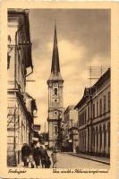 Érsekújvár, Nové Zamky; Utcarészlet, plébánia templom, üzletek, kiadja Jaksics Ferenc / street, church, shops (EK)
