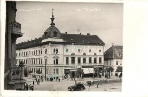 1940 Kolozsvár, Cluj; Református Teológiai Intézet, Dr. Cseresznyés Gyula gyógyszertára, Sallak Dezső, Bindácz János üzlete, automobil / Protestant Theological Institute, pharmacy, shops, automobile. photo