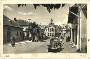 1941 Fülek, Filakovo; Fő utca autóval, Illés L. autó és taxi üzlete / main street with automobile and taxi shop (EK)