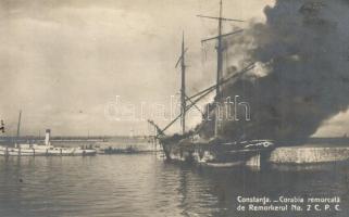 Constanta, Corabia remorcata de Remorkerul No. 2. C.P.C. / Ship caught on fire being towed by a tugboat