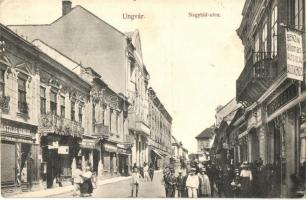 Ungvár, Uzshorod, Uzhhorod, Uzhorod; Nagyhíd utca, Drogéria, gyógyszertár, Goldstein Miksa és Güntzler Henrik üzlete, Benzin állomás, benzinkút. Földesi Gyula kiadása / street view with pharmacy and shops, gas station