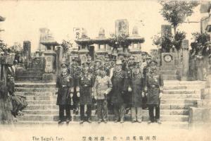 Kagoshima, Kagoshima Prefecture; Saigo Takamoris tomb. Officials pose in front of the tomb of Saigo Takamori (1828-1877) and his troops in Kagoshima City. Saigo Takamori, often called the last samurai, played an important, and later divisive, role in the Meiji Restoration. He led a rebellion against the newly established government in 1877 (Meiji 10), known as the Satsuma uprising. When he was defeated, he committed Seppuku (ritual suicide).