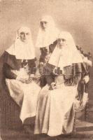 Alexandra Feodorovna, Empress of Russia and her daugthers, Grand Duchess Olga Nikolaevna and Grand Duchess Tatiana Nikolaevna, in nursing uniforms (they treated wounded soldiers at a military hospital on the grounds of Tsarskoye Selo) (EK)