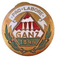 1944. "Pro Labore Ganz 1844" zománcozott és aranyozott Cu jelvény, kiadva a Ganz 100. évfordulójára, hátoldalán "MORZSÁNYI BUDAPEST VÁCI UTCA 36." gyártói jelzéssel (27mm) T:2 /  Hungary 1944. "Pro Labore Ganz 1844" enamelled and gold plated Cu badge, issued for the 100th anniversary of the Ganz factory, with "MORZSÁNYI BUDAPEST VÁCI UTCA 36." makers mark (27mm) C:XF