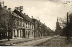 Moson, Fő utca, Moson városi és vidéki takarékpénztár rt., templom. Kiadja Freitag Frigyes