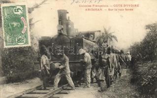 Abidjan, Abidjean; Colonies Francaises, Sur la voie ferrée / locomotive on the railrod with African people. TCV card