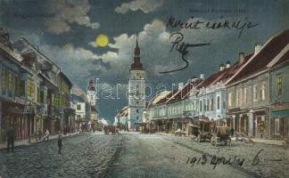 1913 Nagyszombat, Tyrnau, Trnava; Rákóczi Ferenc utca, üzletek, este / street view at night, shop + Postakalauz Nagy-Szombat-Szered-Galanta között (EK)