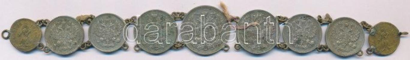 Orosz Birodalom 1912-1914. 10k Ag (4x) + 15k Ag (2xklf) + 20k Ag az érmék ékszerré alakítva, a két szélén Feldzug 1914-15 feliratú zsetonok T:2- patina,sérült láncszemek Russian Empire 1912-1914. 10 Kopeks Ag (4x) + 15 Kopeks Ag (2xdiff) + 20 Kopeks Ag the coins converted into jewelry, with two Feldzug 1914-15 jetons C:VF patina,damaged chain pieces