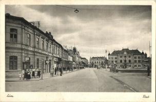 Léva, Levice; Fő út, üzletek, autóbusz, utcai benzintöltő állomás / main street, shops, autobus, gas filling station