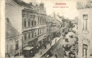 1910 Szombathely, Erzsébet királyné utca, Kemény József üzlete a A Jockey Clubhoz, Babics István Kígyó gyógyszertára - képeslapfüzetből (EK)