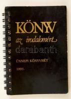 1991 Könyv az irodalomért. Az ünnepi könyvhét sorszámozott kiadványa. 645/1000. Benne 7 iró saját kezű aláírásával: Faludy György,Esterházy Péter, Jókai Anna, Makai Ádám, Mészöly Miklós, Ancsel Éva Spirálfűzött papírkötésben. 184p.