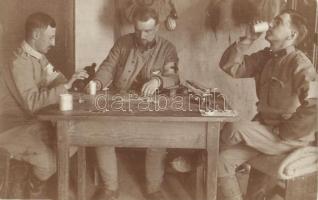 1915 Osztrák-magyar szanitécek dominó játéka az asztalnál, bor és édesség mellett / WWI Austro-Hungarian K.u.K. medics play domino by the table, eating desserts and drinking wine. photo (apró szakadás / tiny tear)