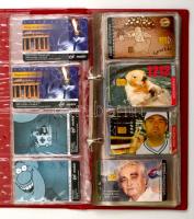 Kb. 500 db magyar telefonkártya, albumba rendezve, 1 db katalógussal, meghívóval