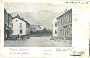 1899 Ruttka, Vrútky; Piac utca, üzlet, háttérben a vasútállomás / Marktplatz / market, street view, shop, railway station (kopott sarkak / worn corners)