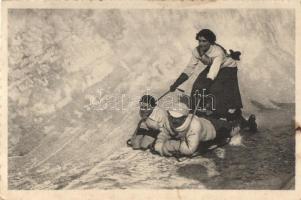 Winter sport, sleddign with woman controlling the direction