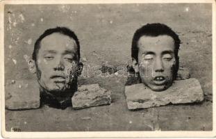 Heads of two Chinese executed men. photo